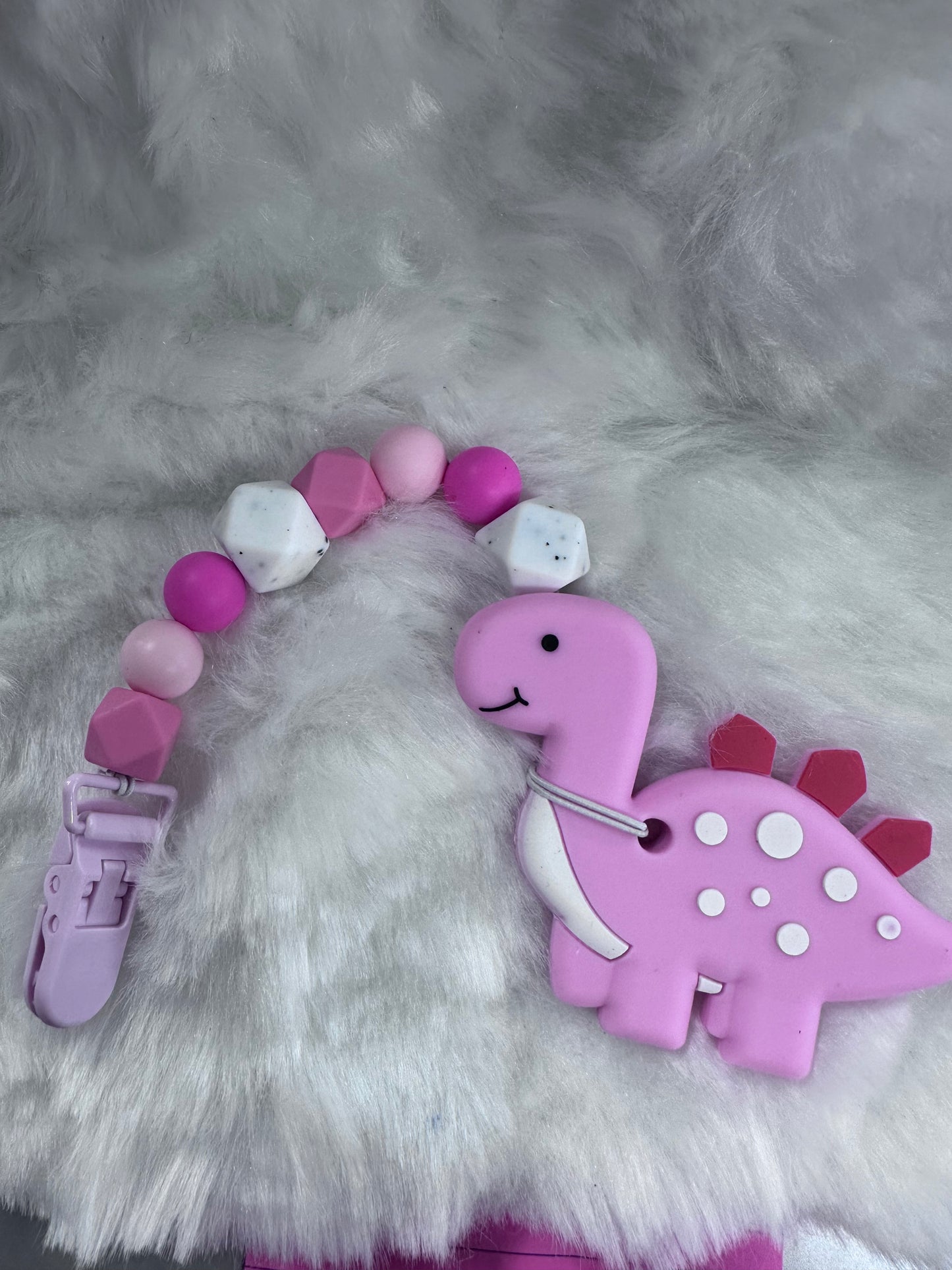 Pink Dino teether with clip